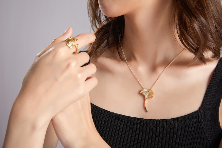 Close up of model wearing layered megems necklaces